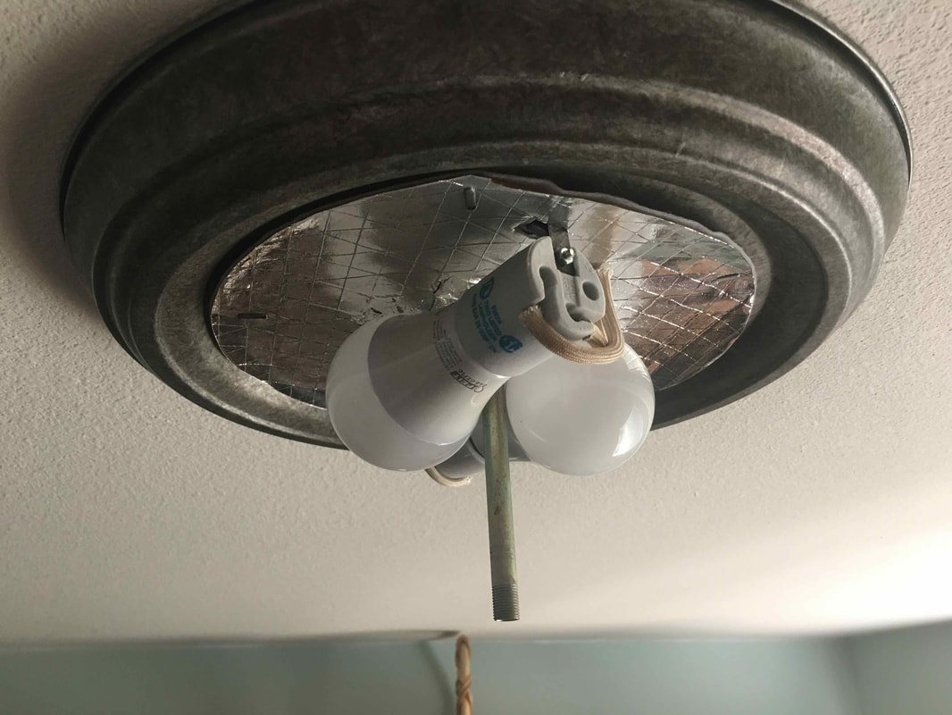 Light bulbs exposed after cover removal.
